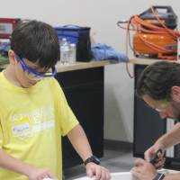 Students build their fuselage with GVSU staff member